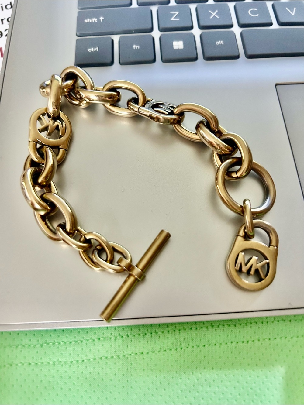 Michael Kors Gold color chunky Link Chain Bracelet with MK Toggle/Charm